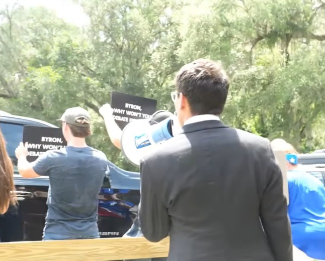 Bullhorns and 'Blah-Blah' Gestures: Fishback Crashes Donalds Campaign Event in Lake City